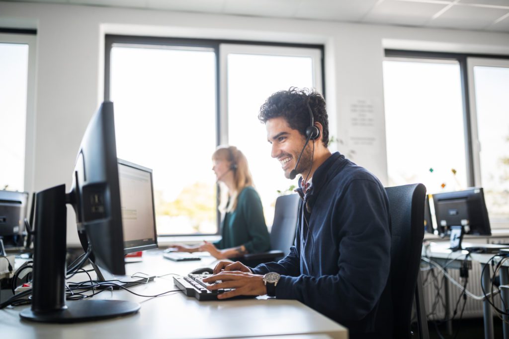 Side view of smiling customer service representative